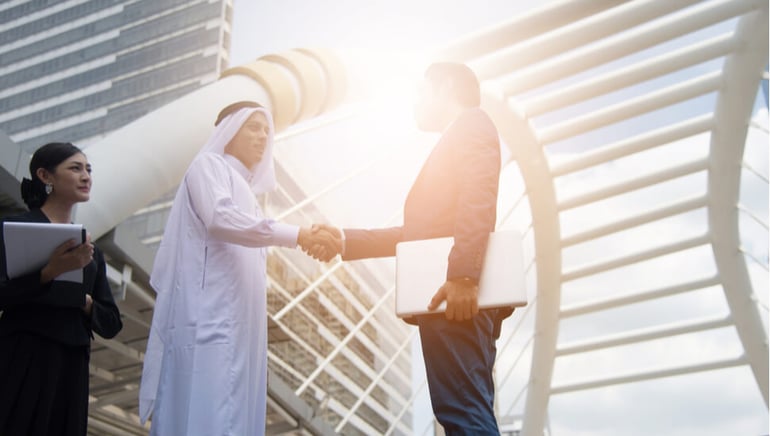 Two Dubai businessmen shaking hands
