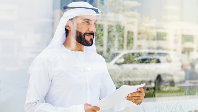 dubai-businessman-holding-regulations