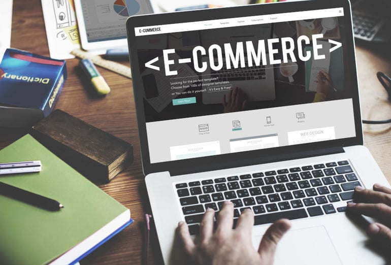 Laptop with the word 'E-Commerce' on the screen
